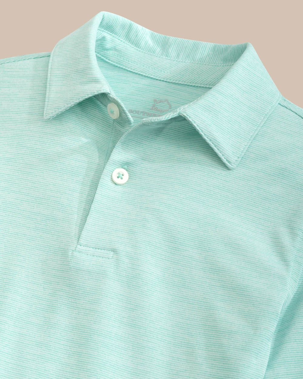 The detail view of the Southern Tide Team Colors Boy's Driver Spacedye Polo Shirt by Southern Tide - Marine Blue