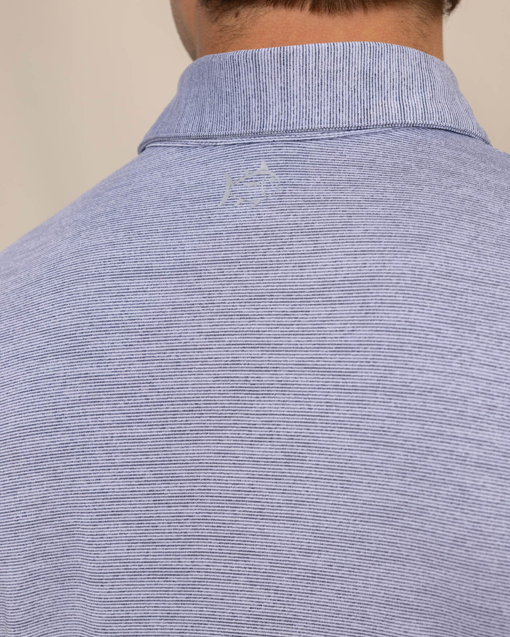 The detail view of the Southern Tide Team Colors Driver Spacedye Polo Shirt by Southern Tide - Navy