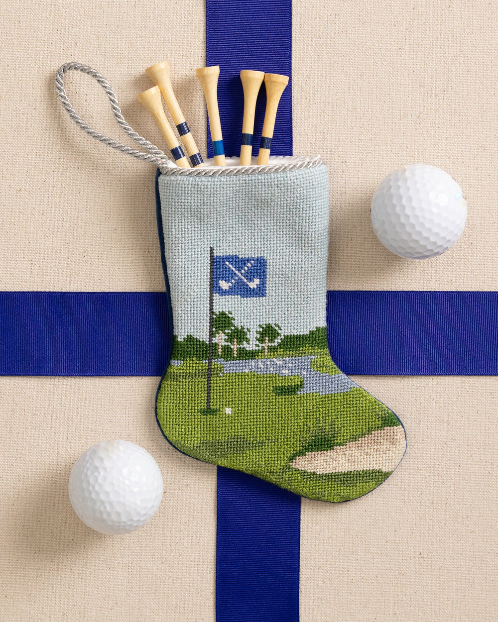 The front view of the Southern Tide Tee Time Golf Needlepoint Stocking by Southern Tide - Blue
