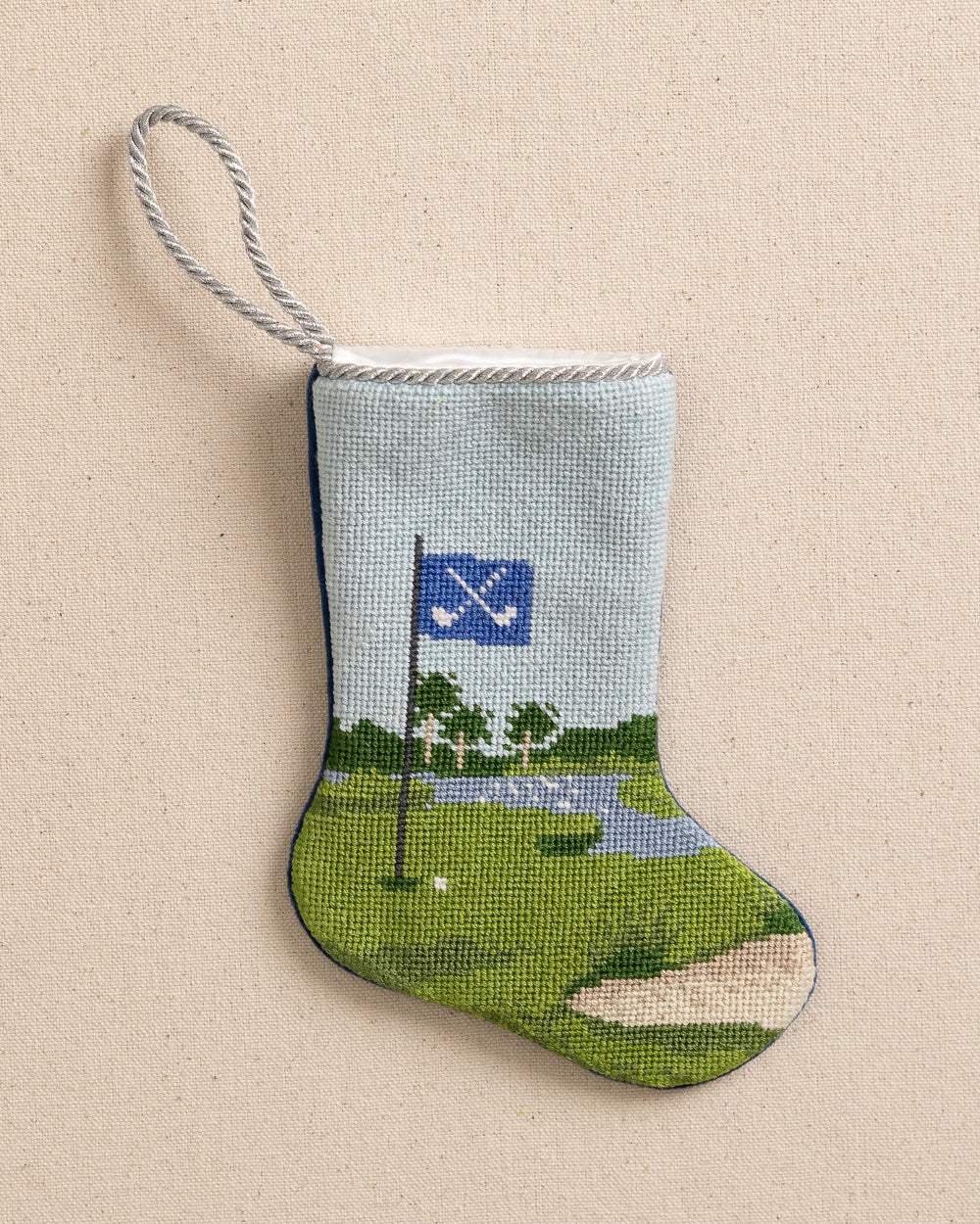 The front view of the Southern Tide Tee Time Golf Needlepoint Stocking by Southern Tide - Blue