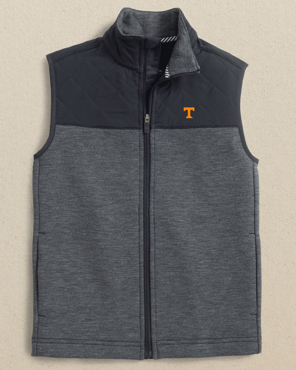 The front view of the Southern Tide Tennessee Vols Boys Waterfront Quilted Vest by Southern Tide - Caviar Black