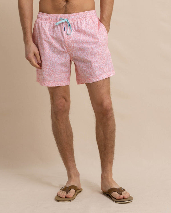 The front view of the Southern Tide That Floral Feeling Swim Trunk by Southern Tide - Apricot Blush Coral