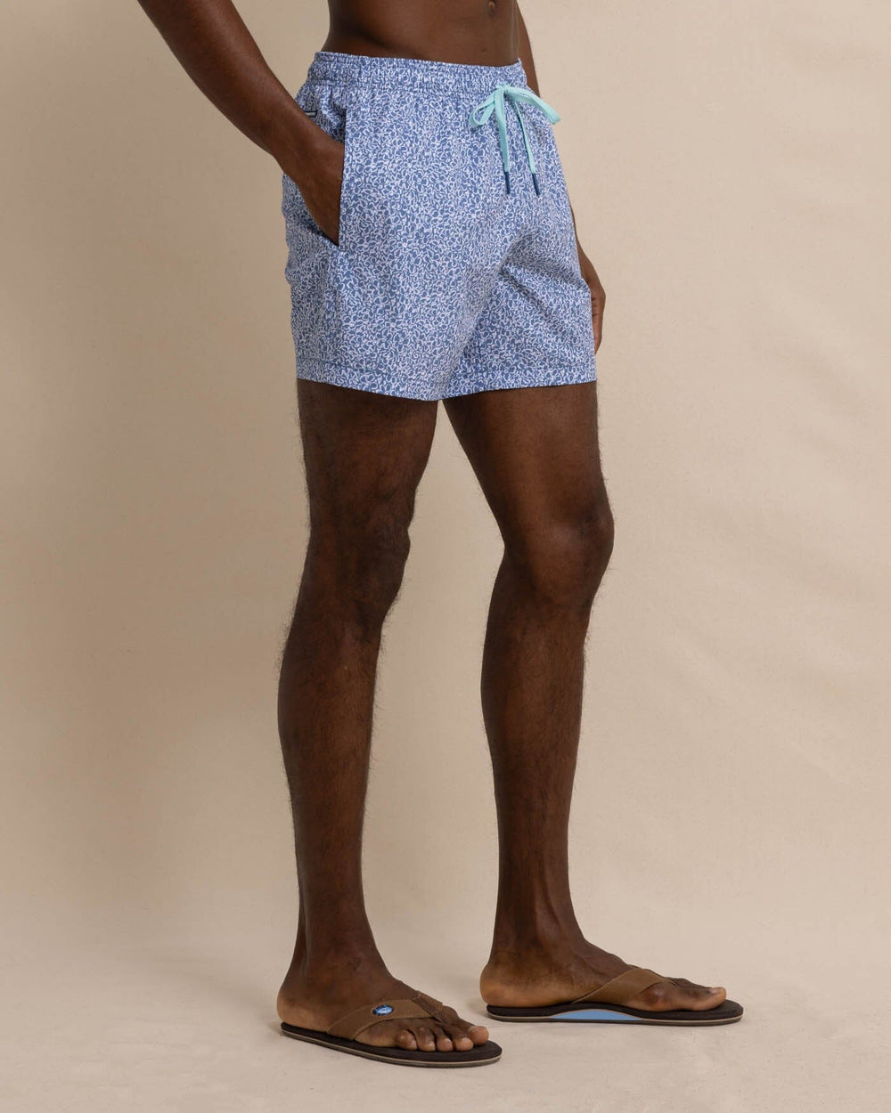 The front view of the Southern Tide That Floral Feeling Swim Trunk by Southern Tide - Coronet Blue