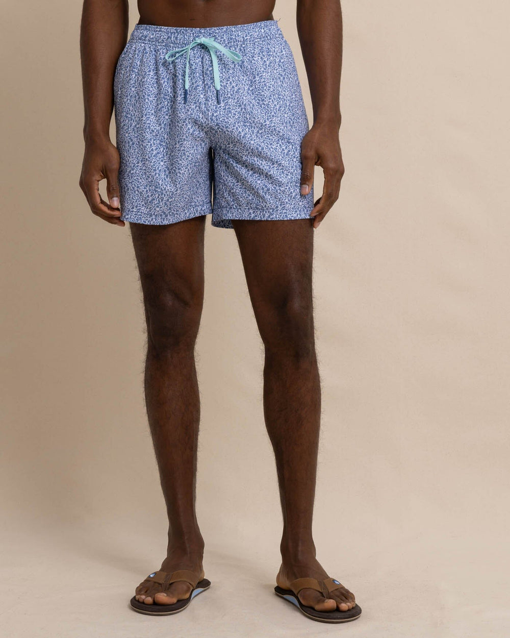 The front view of the Southern Tide That Floral Feeling Swim Trunk by Southern Tide - Coronet Blue