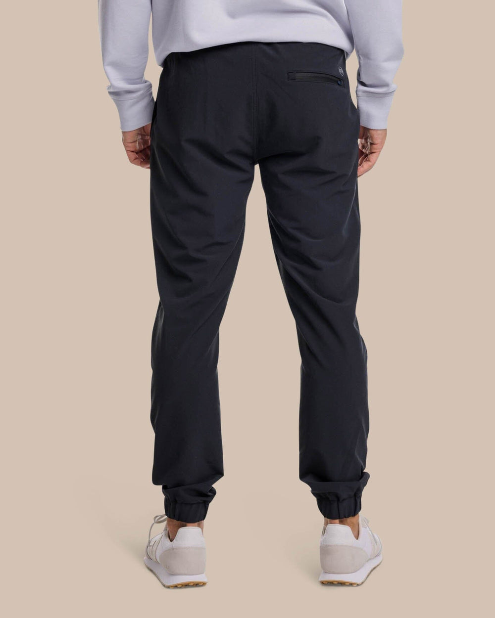 The back view of the Southern Tide The Excursion Performance Jogger by Southern Tide - Caviar Black