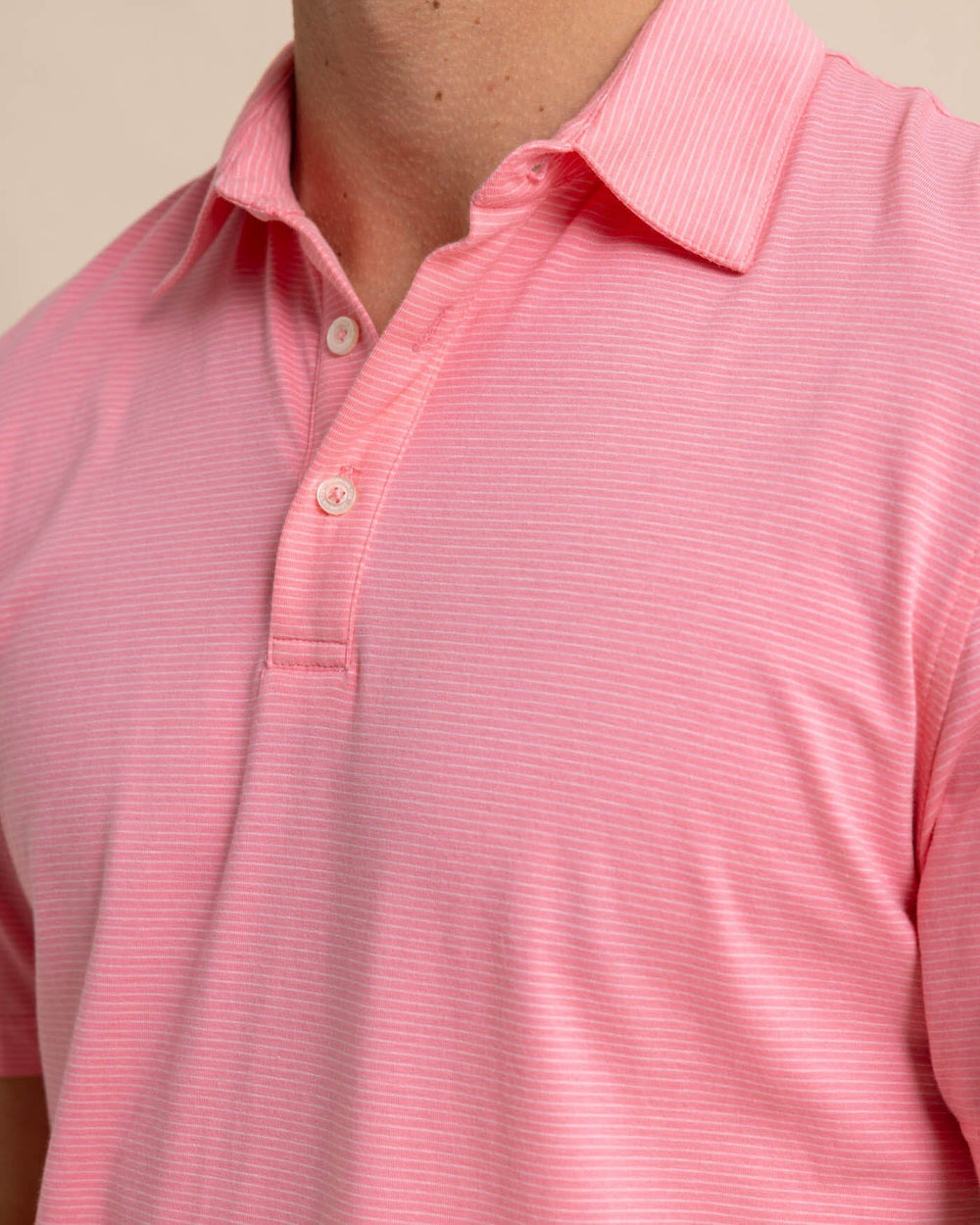 The detail view of the Southern Tide The Seaport Davenport Stripe Polo by Southern Tide - Geranium Pink
