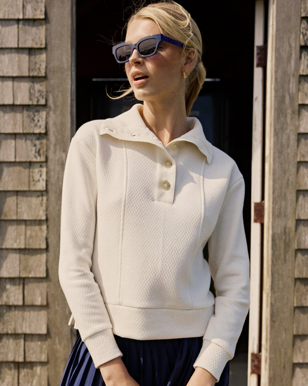 The lifestyle view of the Southern Tide Tonya Button Mock Pullover by Southern Tide - Sand White