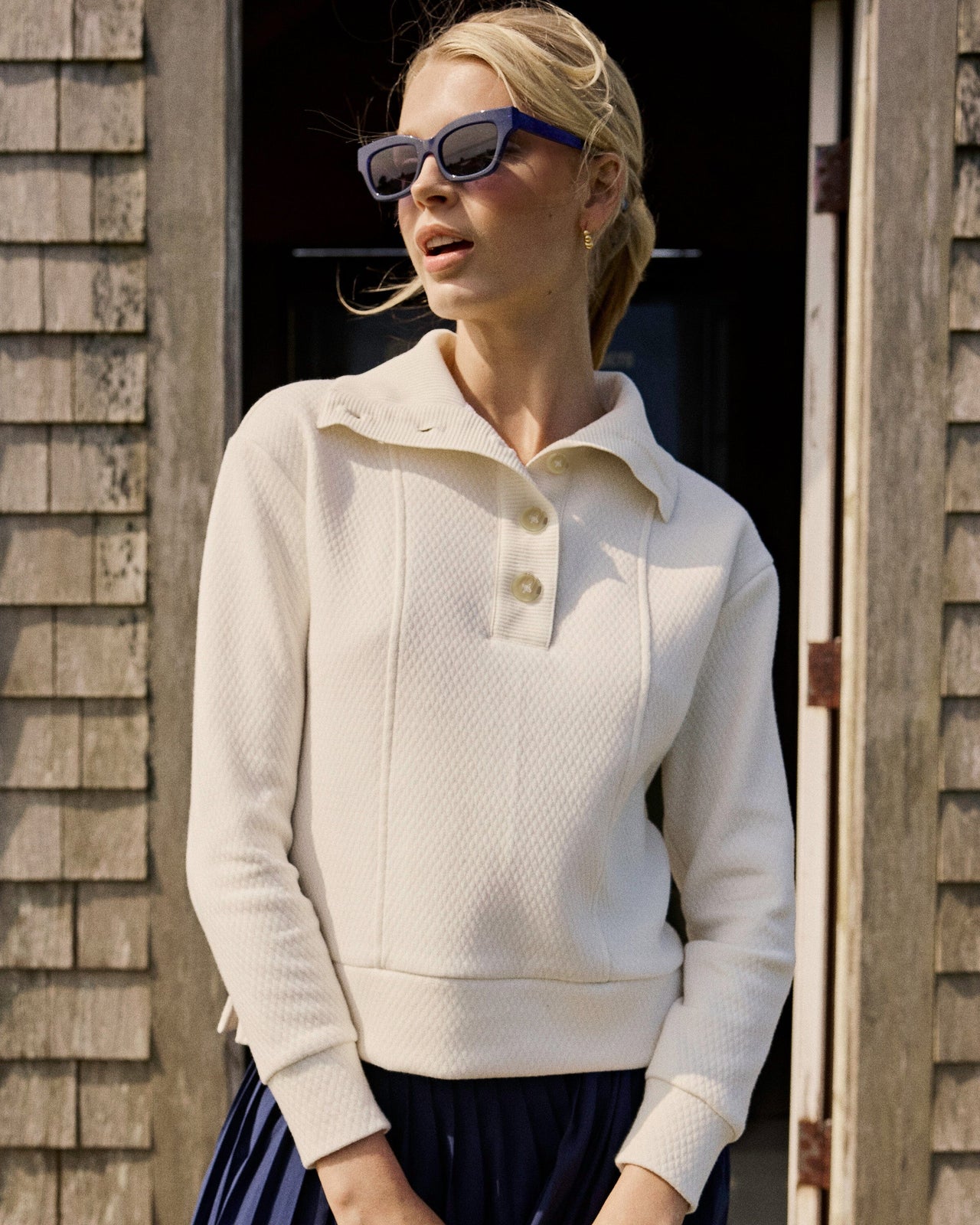 The lifestyle view of the Southern Tide Tonya Button Mock Pullover by Southern Tide - Sand White
