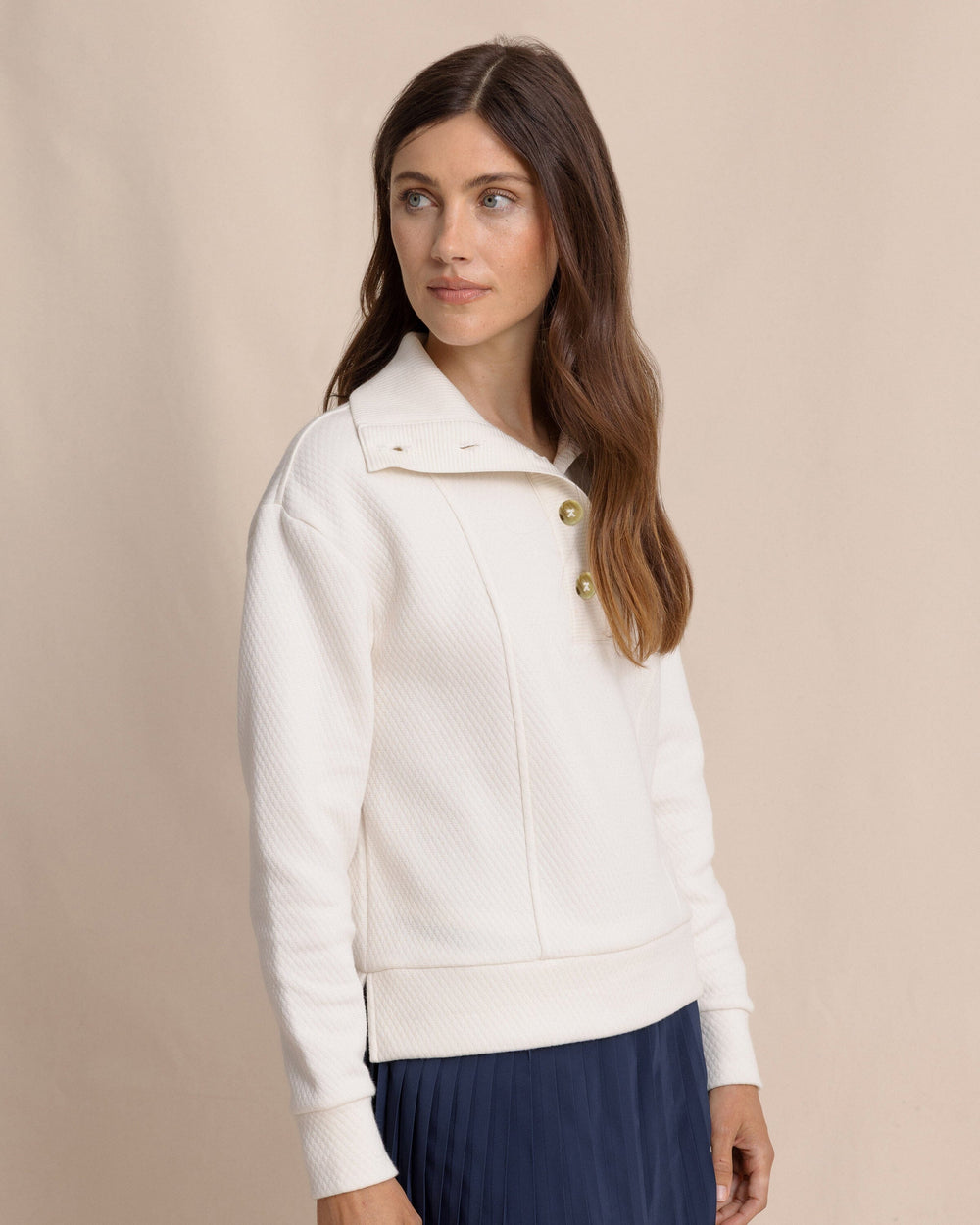 The side view of the Southern Tide Tonya Button Mock Pullover by Southern Tide - Sand White