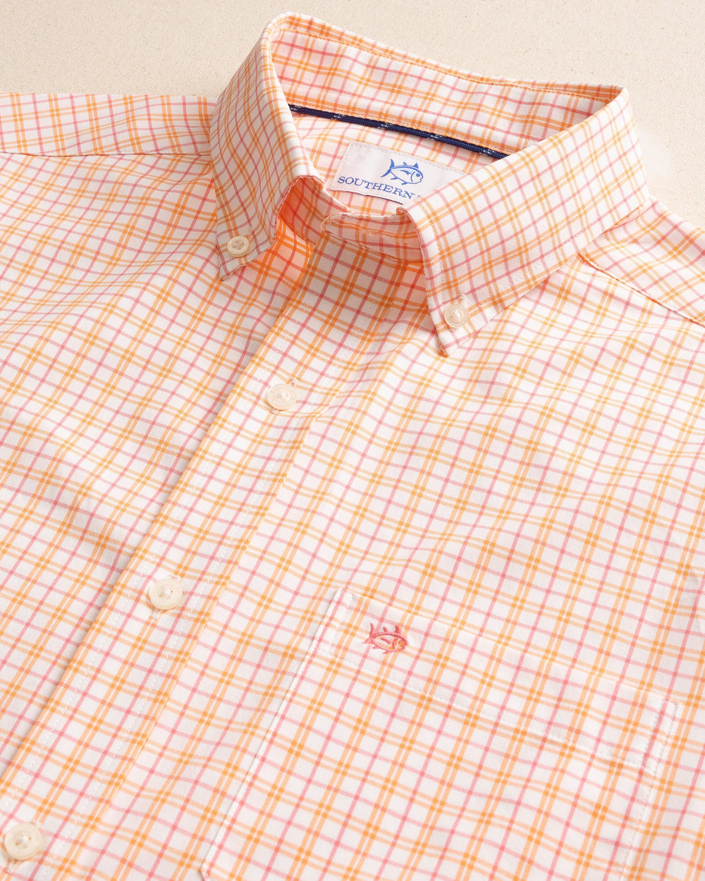 The detail view of the Southern Tide Turnberry Plaid Intercoastal Long Sleeve Sport Shirt by Southern Tide - Peach Parfait