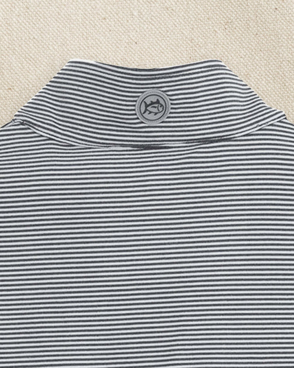 The detail view of the Southern Tide UCF Knights Cruiser Micro-Stripe Quarter Zip by Southern Tide - Heather Black