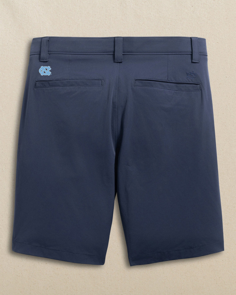 The back view of the Southern Tide UNC Tar Heels Birdie 8" Coastal Breeze® Performance Short by Southern Tide - True Navy