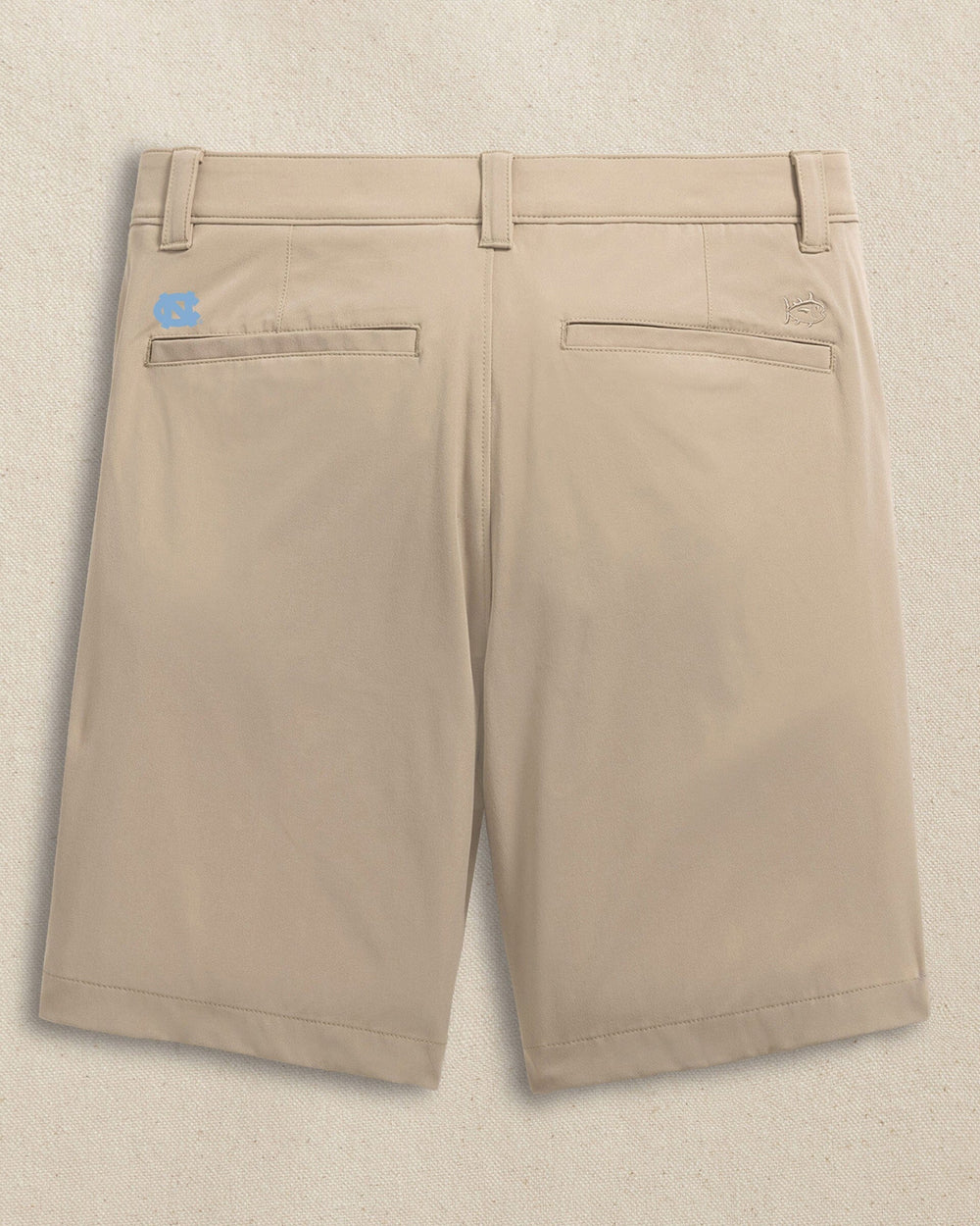The back view of the Southern Tide UNC Tar Heels brrr°®-die 8" Performance Short by Southern Tide - Sandstone Khaki