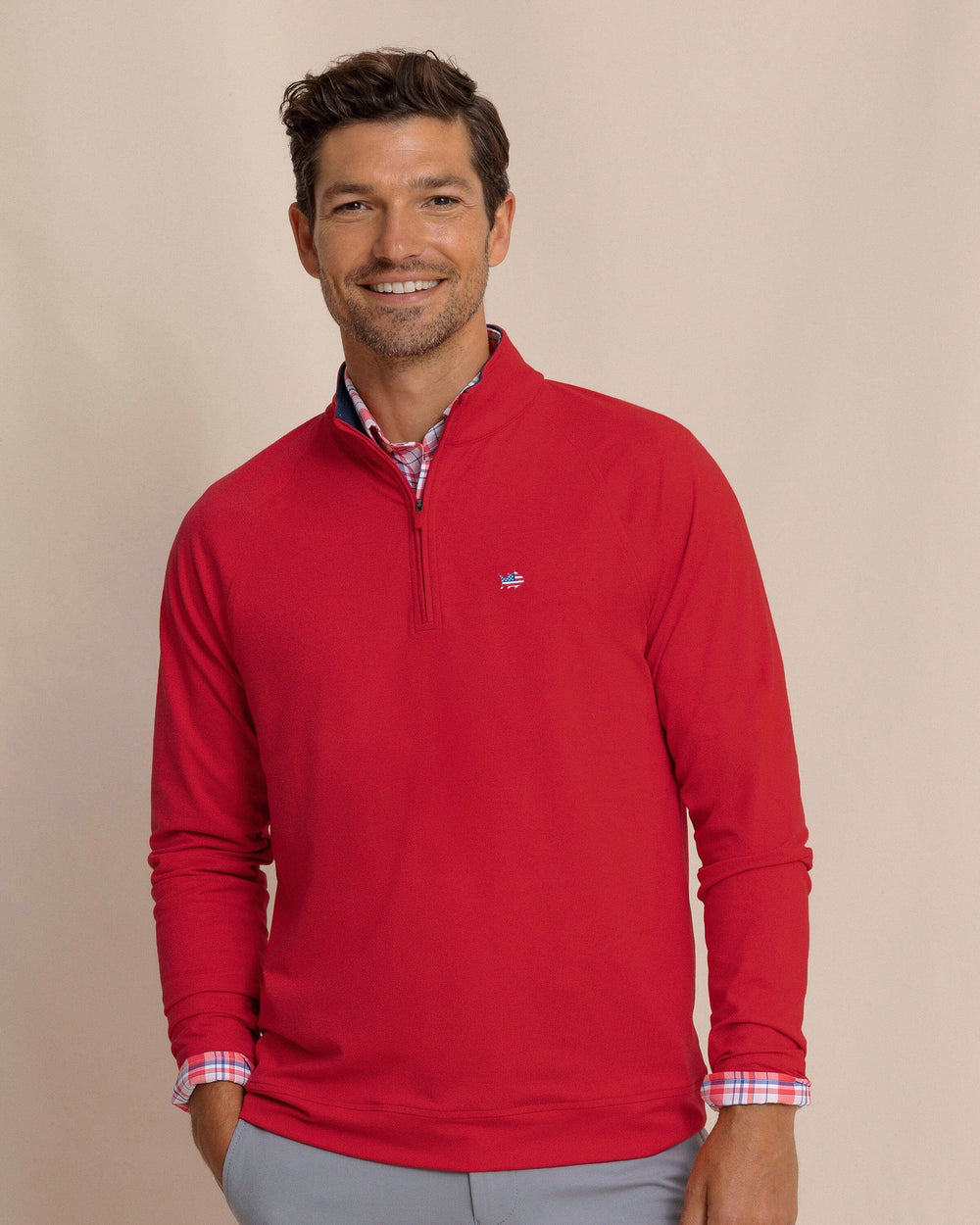 The front view of the Southern Tide USA Flag Skipjack Cruiser Heather Quarter Zip by Southern Tide - Heather Crab Red