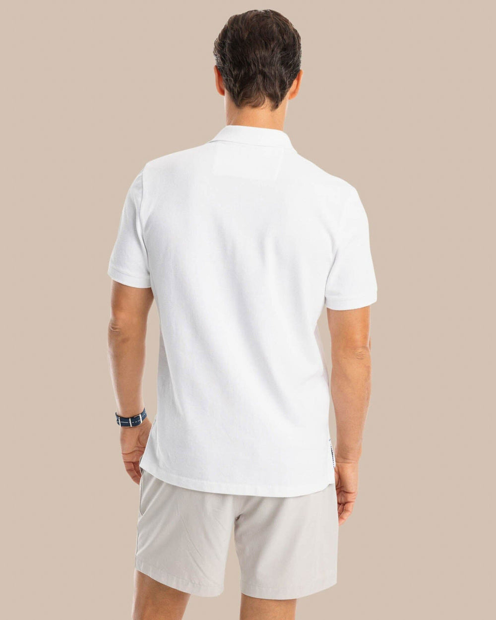 The back view of the Southern Tide USA Flag Skipjack Polo by Southern Tide - Classic White