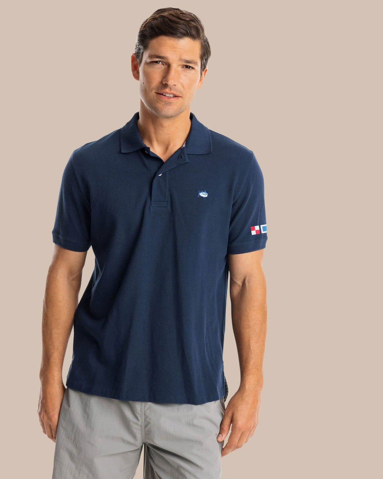 The front view of the Southern Tide USA Nautical Flags Skipjack Polo by Southern Tide - True Navy