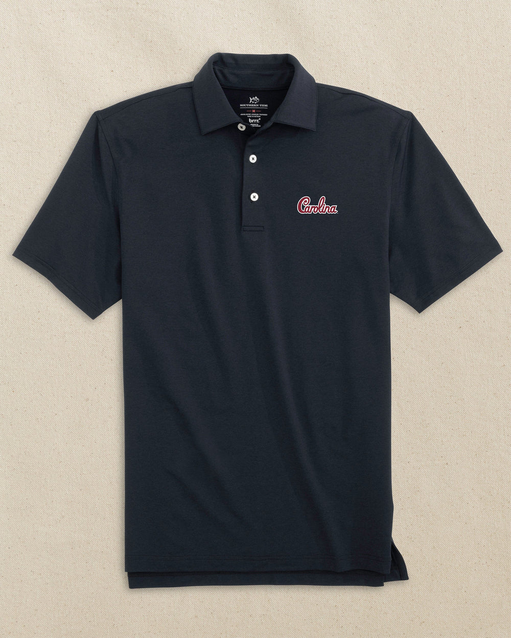 The front view of the Southern Tide USC Gamecocks brrr°®-eeze Heather Polo Carolina Script by Southern Tide - Heather Caviar Black
