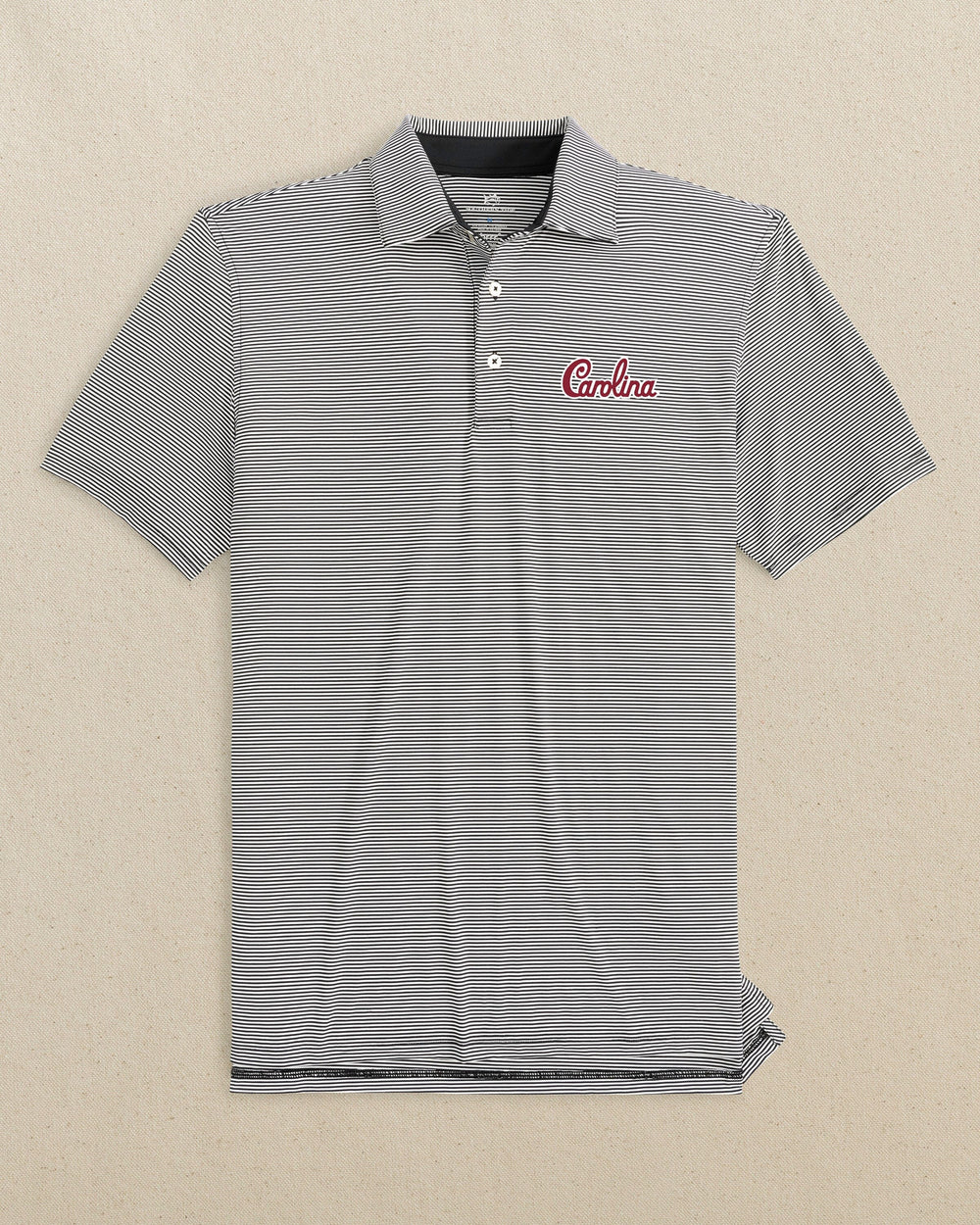 The front view of the Southern Tide USC Gamecocks brrr°®-eeze Meadowbrook Stripe Polo Carolina Script by Southern Tide - Caviar Black