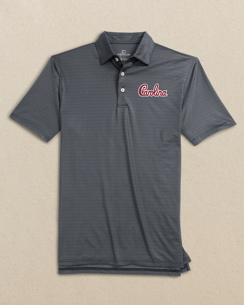 The front view of the Southern Tide USC Gamecocks Driver ST Geo Printed Polo Carolina Script by Southern Tide - Caviar Black