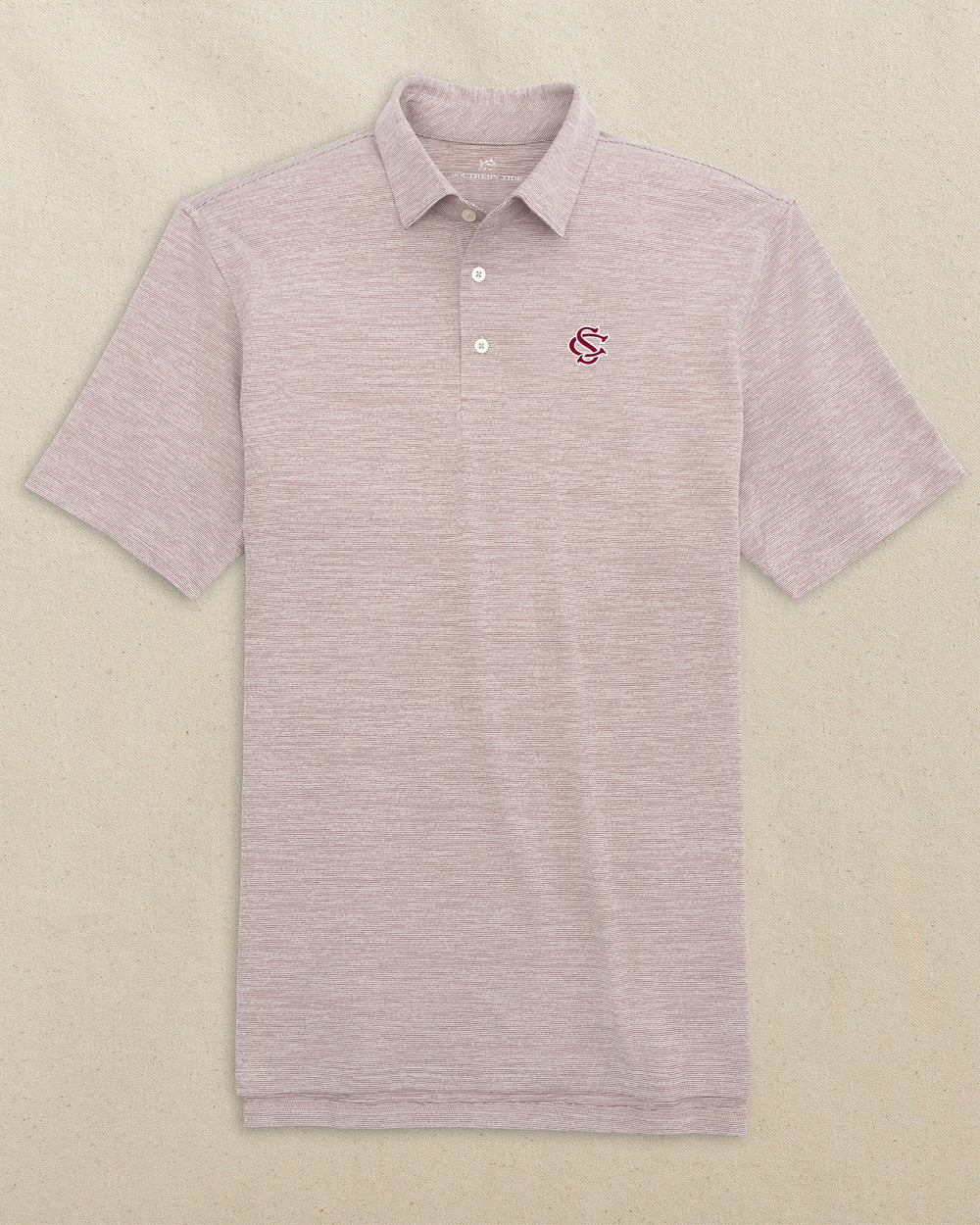 The front view of the Southern Tide USC Gamecocks Interlocking SC Driver Spacedye Polo by Southern Tide - Chianti