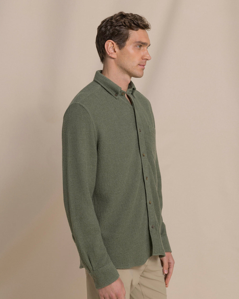 The side view of the Southern Tide Waffle Weave Heather Sport Shirt by Southern Tide - Heather Cedar Green