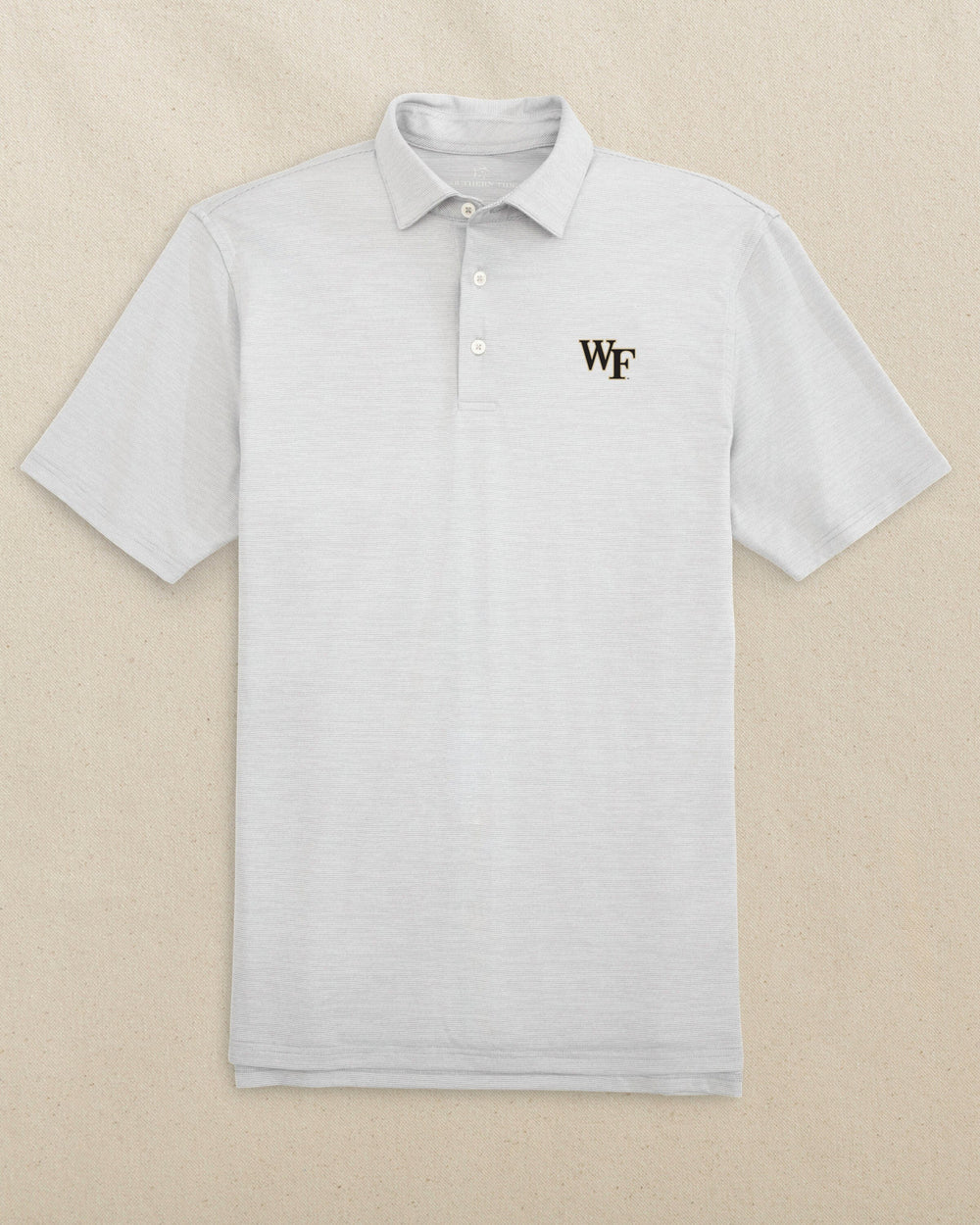 The front view of the Southern Tide Wake Forest Demon Deacons Driver Spacedye Polo by Southern Tide - Slate Grey
