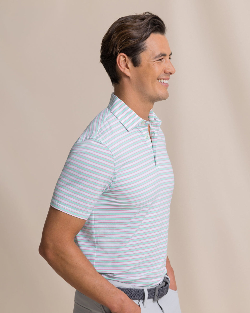 The side view of the Southern Tide Water Way Stripe Coastal Breeze® Performance Polo by Southern Tide - Gulf Shores