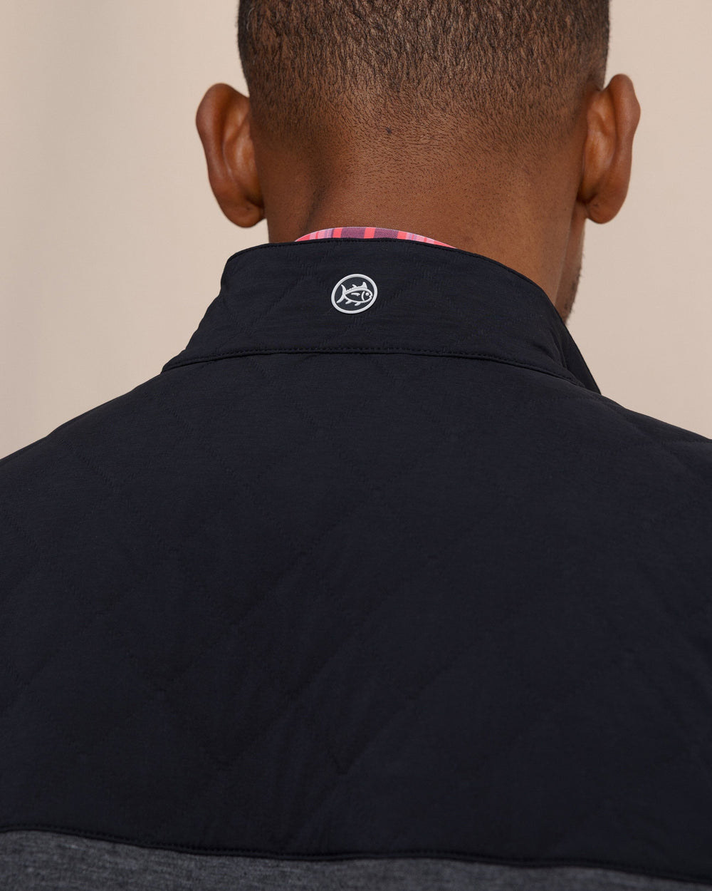 The detail view of the Southern Tide Waterfront Quilted Vest by Southern Tide - Caviar Black