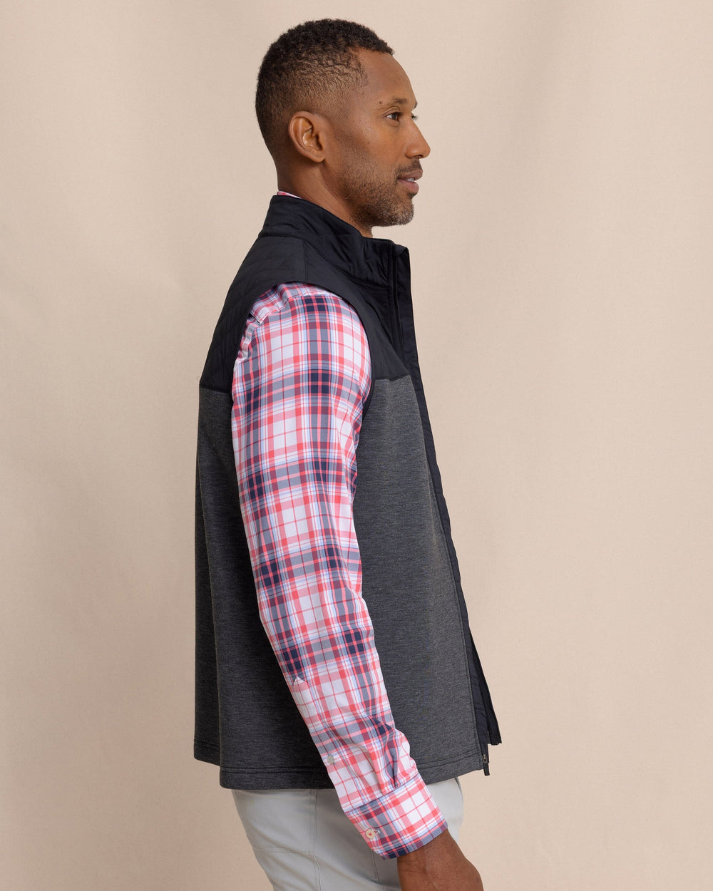 The side view of the Southern Tide Waterfront Quilted Vest by Southern Tide - Caviar Black