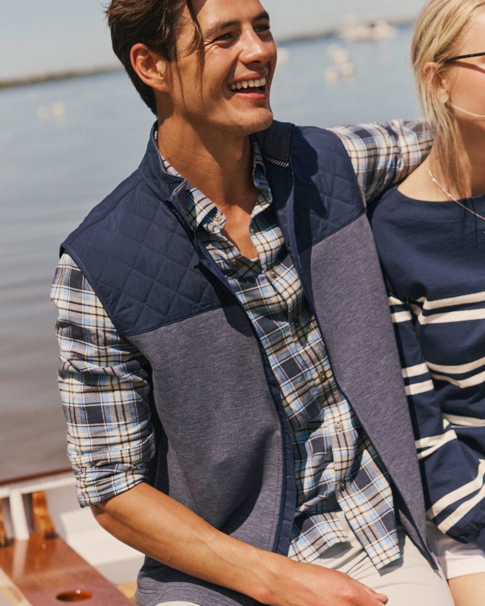 The lifestyle view of the Southern Tide Waterfront Quilted Vest by Southern Tide - Dress Blue