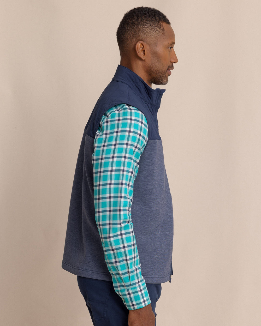 The side view of the Southern Tide Waterfront Quilted Vest by Southern Tide - Dress Blue
