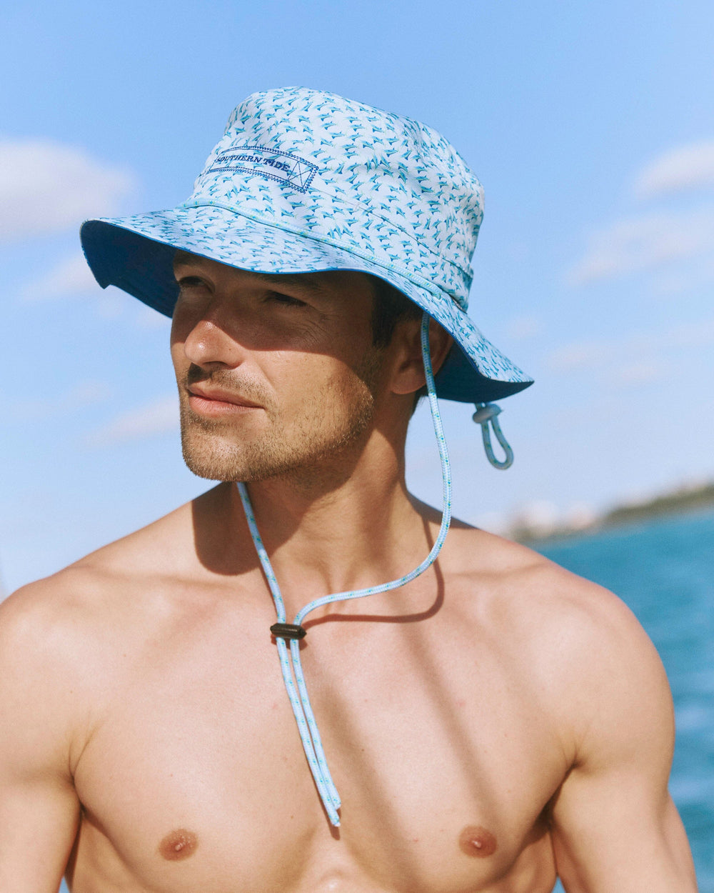 The lifestyle view of the Southern Tide Waterway Fintastic Performance Sun Hat by Southern Tide - Cerulean