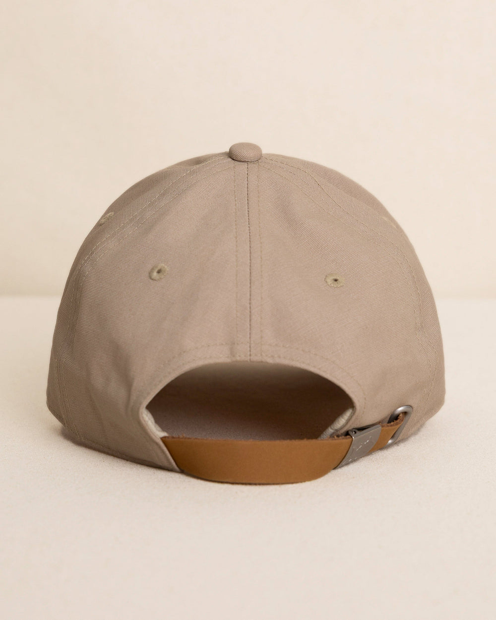 The back view of the Southern Tide Waxed Canvas Leather Strap Hat by Southern Tide - Sandstone Khaki