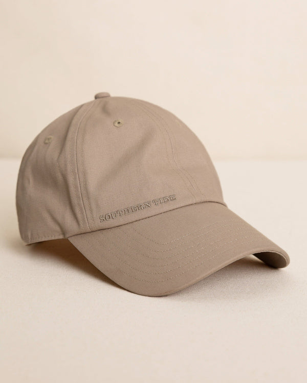 The front view of the Southern Tide Waxed Canvas Leather Strap Hat by Southern Tide - Sandstone Khaki