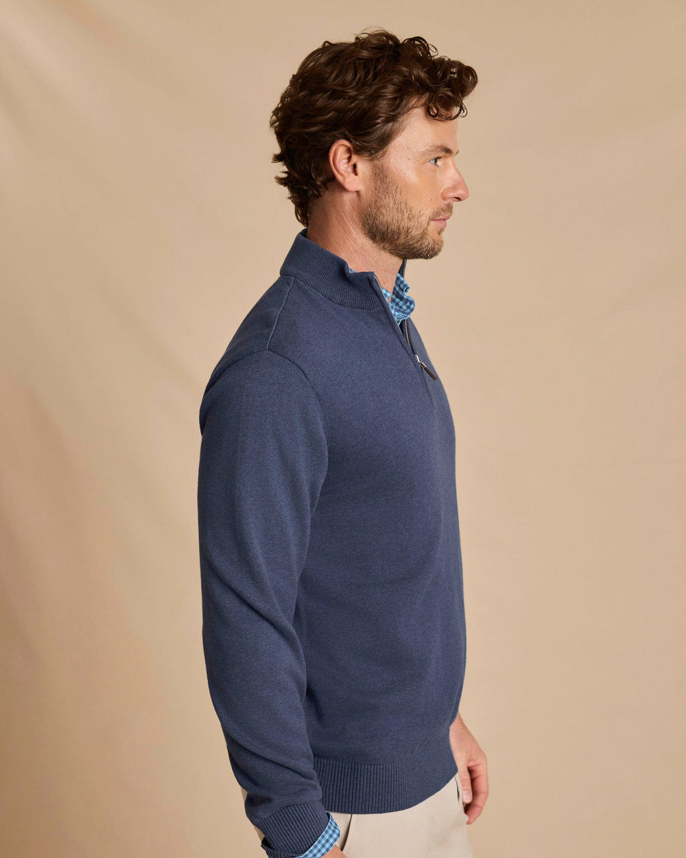The side view of the Southern Tide Whitehaven Heather Quarter Zip Sweater by Southern Tide - Heather Nautical Blue