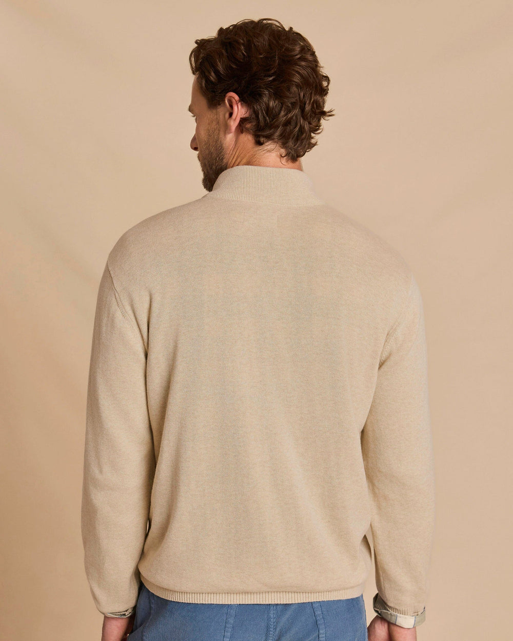 The back view of the Southern Tide Whitehaven Heather Quarter Zip Sweater by Southern Tide - Heather Sand Dunes