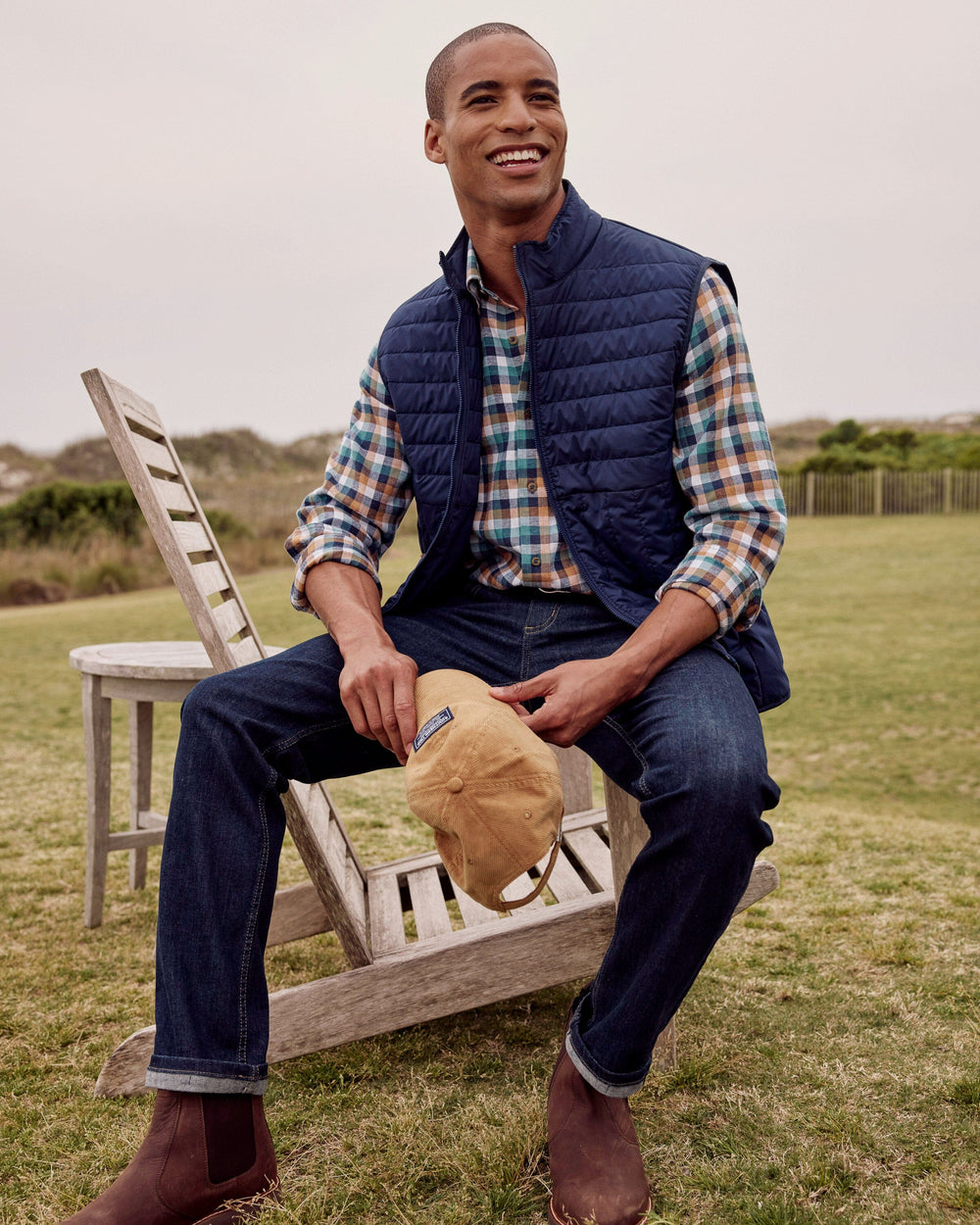 The lifestyle view of the Southern Tide Whitemarsh Packable Quilted Vest by Southern Tide - Dress Blue