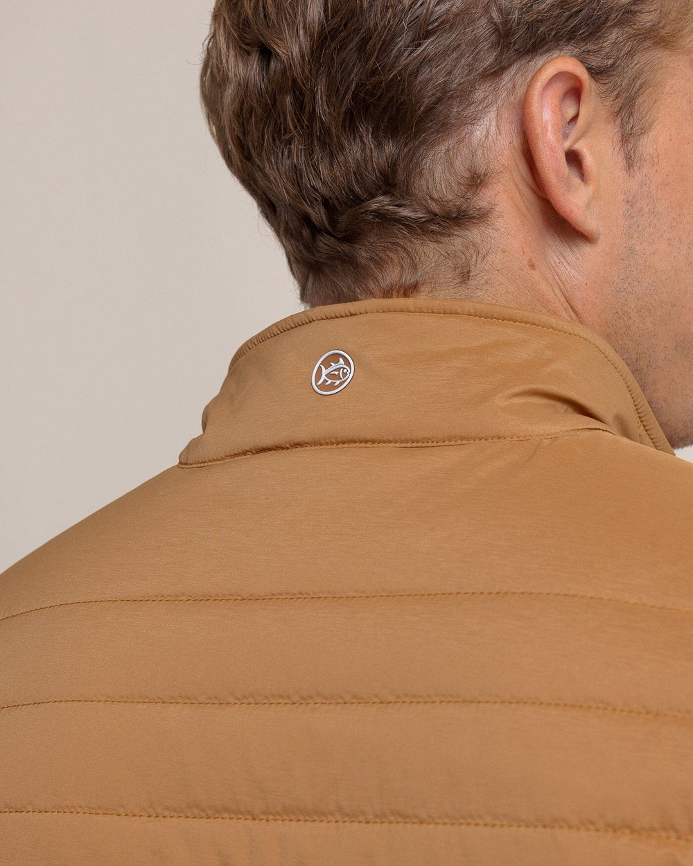 The back view of the Southern Tide Whitemarsh Packable Quilted Vest by Southern Tide - Hazelnut Khaki