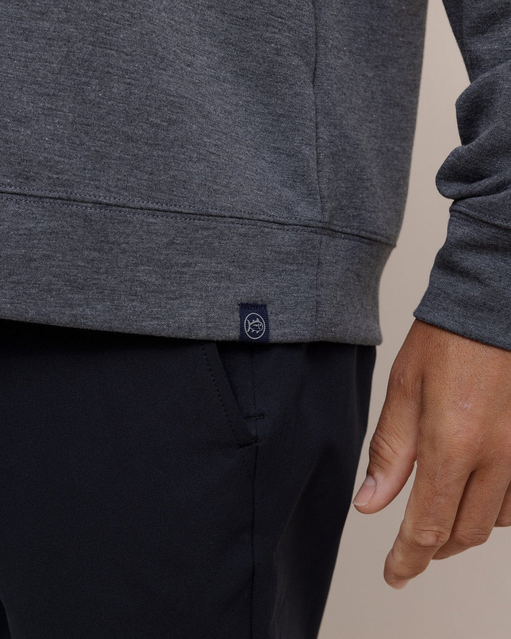 The hem view of the Southern Tide Whyche Interlock Heather Quarter Zip by Southern Tide - Heather Castle Rock