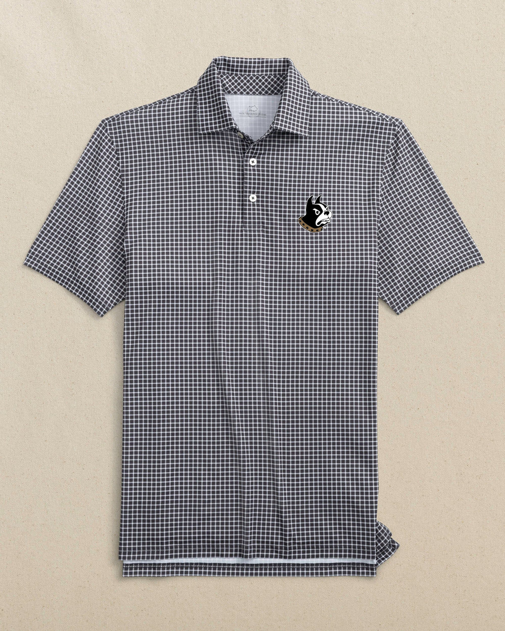 The front view of the Southern Tide Wofford Terriers Driver Dunes Edge Plaid Polo by Southern Tide - Black
