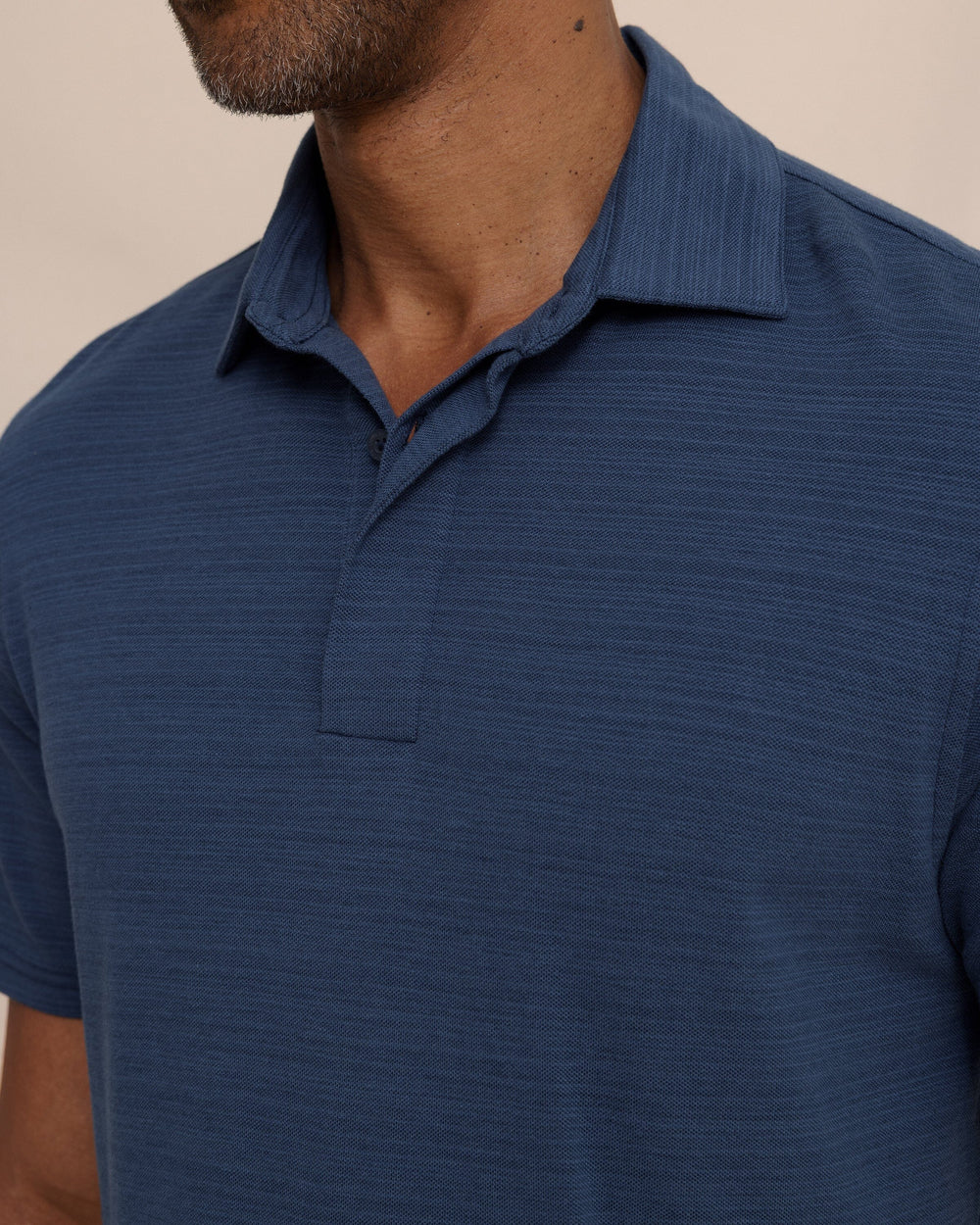 The detail view of the Southern Tide Woodland Covered Placket Polo by Southern Tide - Dress Blue