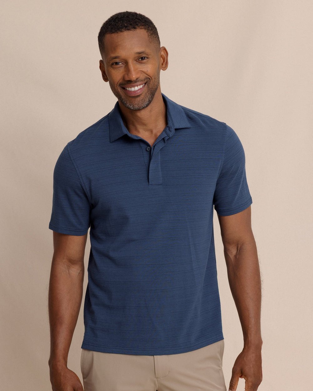 The front view of the Southern Tide Woodland Covered Placket Polo by Southern Tide - Dress Blue