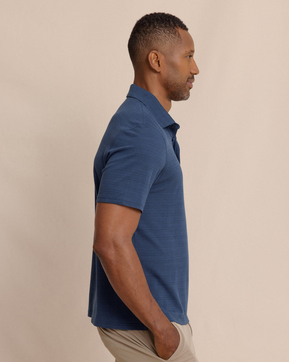The side view of the Southern Tide Woodland Covered Placket Polo by Southern Tide - Dress Blue