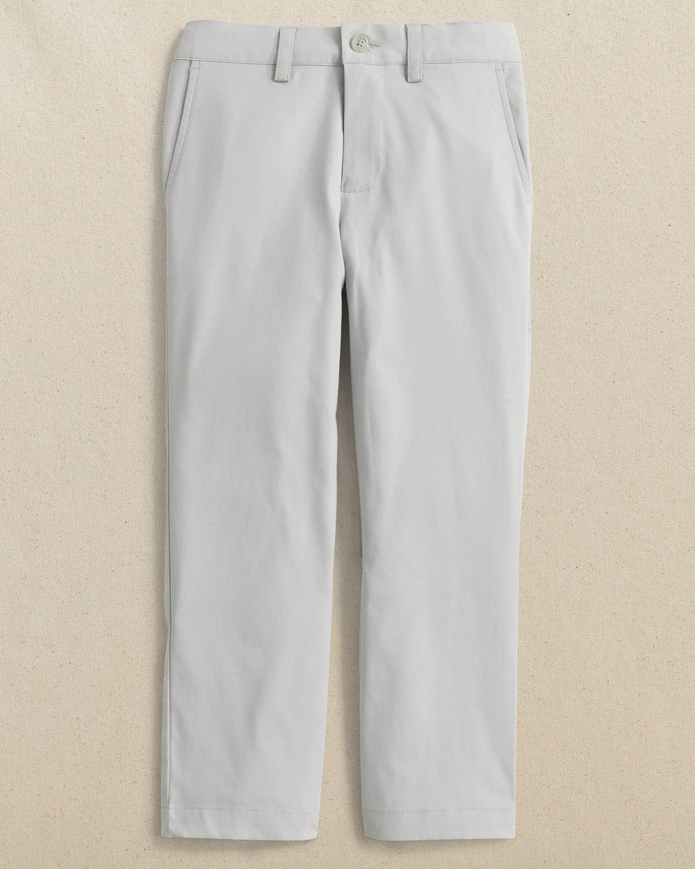 The front view of the Youth Leadhead Performance Pant by Southern Tide - Seagull Grey