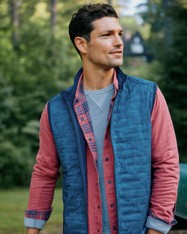 The lifestyle view of the Abercorn Camo Performance Vest by Southern Tide - True Navy
