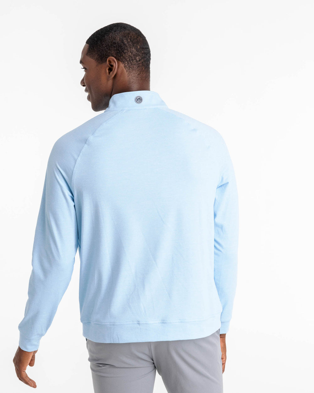 The back view of the Backbarrier Heather Performance Quarter Zip Pullover by Southern Tide - Heather Aquamarine