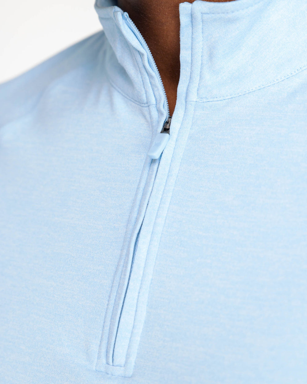 The detail view of the Backbarrier Heather Performance Quarter Zip Pullover by Southern Tide - Heather Aquamarine