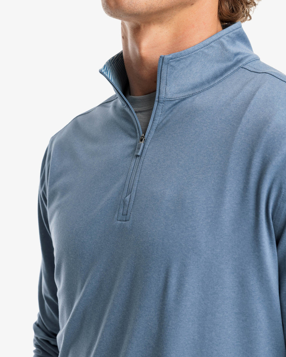 The detail view of the Backbarrier Heather Performance Quarter Zip Pullover by Southern Tide - Heather Blue Haze