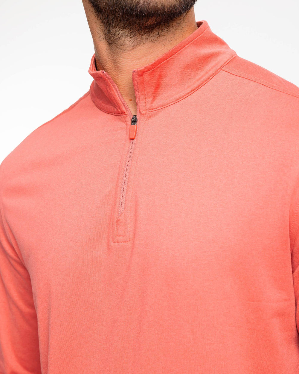 The detail view of the Backbarrier Heather Performance Quarter Zip Pullover by Southern Tide - Heather Mineral Red