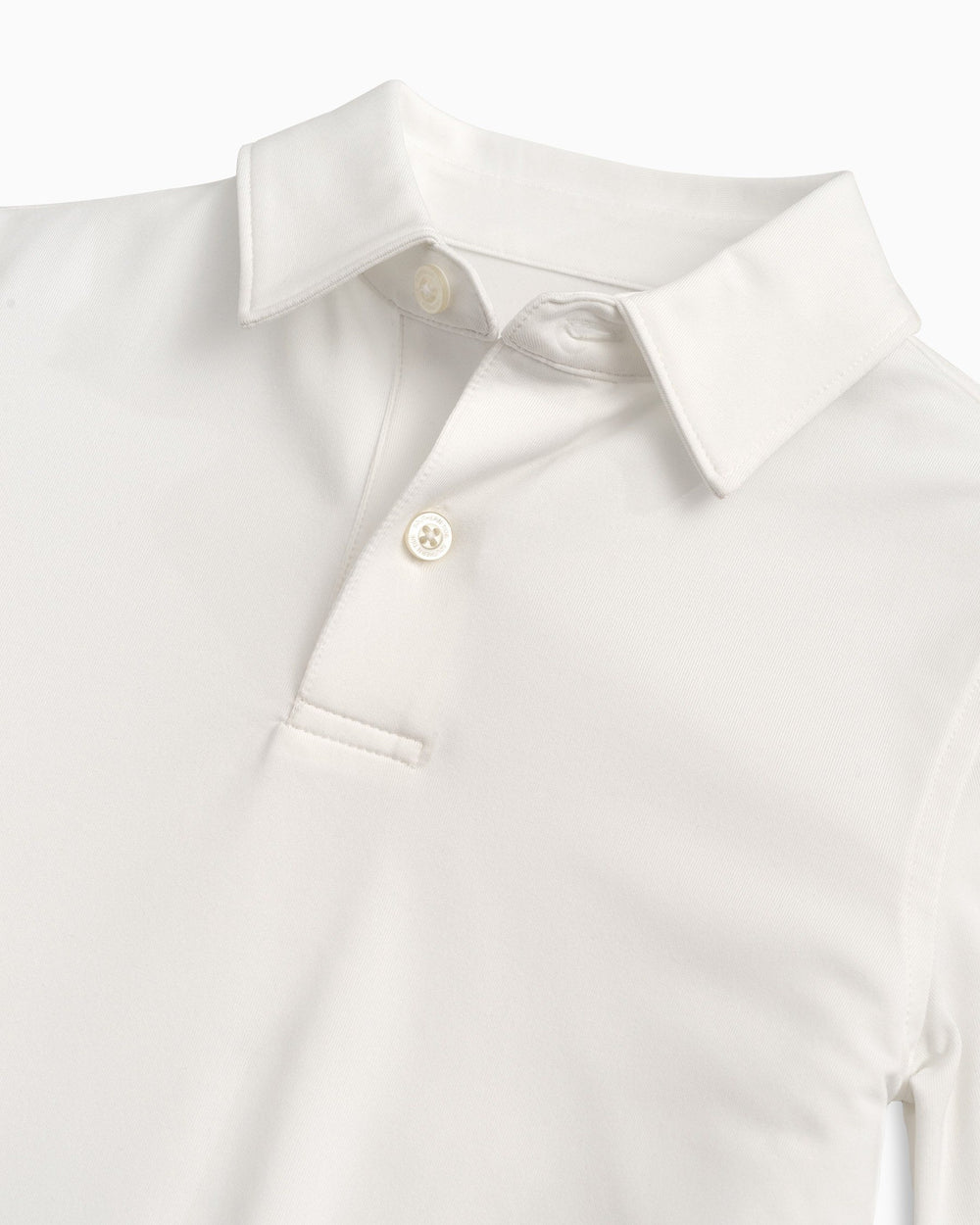 The detail view of the Boys Driver Performance Polo Shirt by Southern Tide - Classic White
